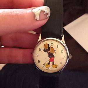 Vintage wrist watch with leather straps and Mickey Mouse.